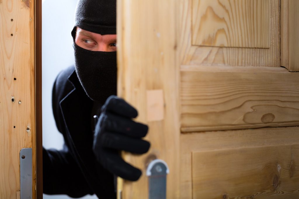 Burglar breaking in an apartment