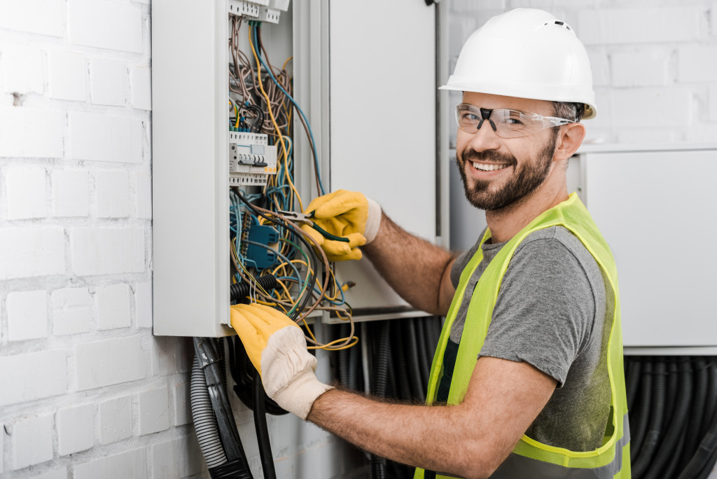 An electrician checking an electric box