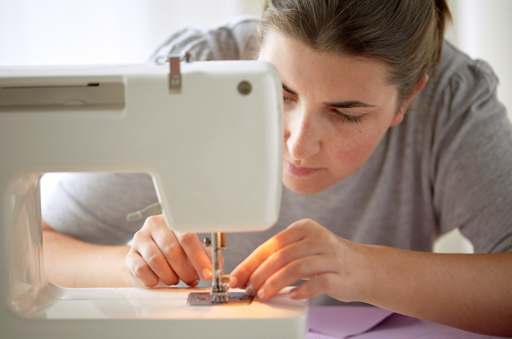 woman stitching at home